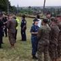 Military officials and Honolulu Police Department officers talked at a beach park where search and rescue officials are meeting in Haleiwa, Hawaii, on Friday.