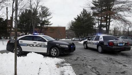Police cars outside of Arlington High School after the school received a bomb threat Tuesday.
