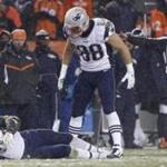 Denver CO 11/29/15 Patriot tight end Rob Gronkowski grimaces in pain after being injured as temmate Scott Chandler looks on. New England Patriots Denver Broncos during first quarter action at Sports Authority Field at Mile High n on Friday November 29, 2015. (Matthew J. Lee/Globe staff) Topic: Reporter: 