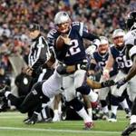 FOXBORO, MA - JANUARY 10: Tom Brady #12 of the New England Patriots runs in for a touchdown in the first quarter against the Baltimore Ravens during the 2014 AFC Divisional Playoffs game at Gillette Stadium on January 10, 2015 in Foxboro, Massachusetts. (Photo by Jim Rogash/Getty Images)