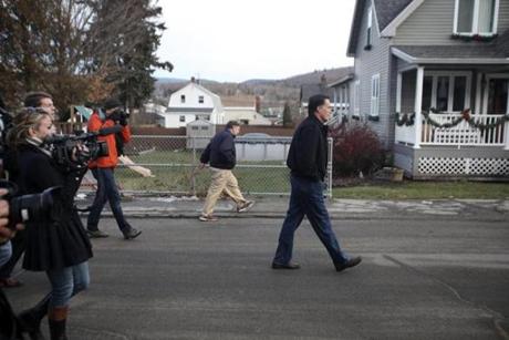 Mitt Romney walked down a street in Berlin, N.H., while campaigning for president in December 2011. 
