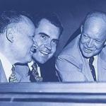 Then US Senator Richard Nixon and Dwight D. Eisenhower speaking at the back of a car in 1952. Other person on picture is unidentified. (Photo credit should read AFP/AFP/Getty Images)