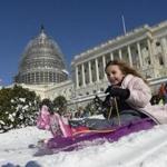 A girl slid down the West Lawn of the US Capitol on Sunday.