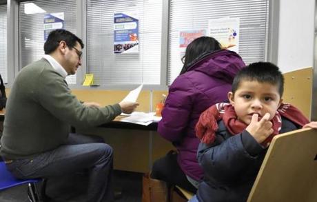 Demaris Villanueva reviewed forms to enroll her son, 3-year-old Israel, in one of Denver?s public schools.
