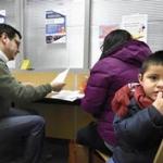 Demaris Villanueva reviewed forms to enroll her son, 3-year-old Israel, in one of Denver?s public schools.