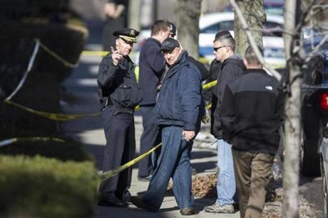 Shooting scene at Harvard St. in Brookline. David L. Ryan/Globe Staff
