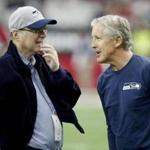 Seattle Seahawks owner Paul Allen (left) spoke with Seahawks headcoach Pete Carroll before a playoff game earlier this month.