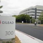 In this photo taken July 9, 2015, a man cycles near the headquarters of Gilead Sciences in Foster City, Calif. A bipartisan investigation by U.S. senators finds that the makers of a breakthrough drug for hepatitis C infection put profits before patients in pricing the $1,000-per-pill cure. The report released Tuesday by the Senate Finance Committee concludes that California-based Gilead Sciences was focused on maximizing revenue even as its own analysis showed a lower price would allow more patients to be treated for the liver-wasting disease. (AP Photo/Eric Risberg)
