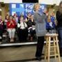Democratic presidential candidate Hillary Clinton reacted as she is introduced by her daughter Chelsea Clinton, right, at a rally at Abraham Lincoln High School in Council Bluffs, Iowa on Sunday.