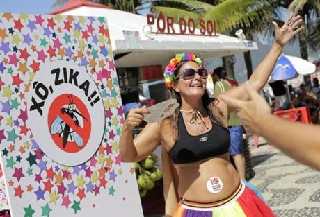 Viviane Oliveira, who is three months pregnant, danced next to a sign that says 