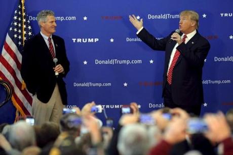 Republican presidential candidate Donald Trump (right) spoke beside host Scott Brown at a campaign rally in Portsmouth, N.H., last month. 
