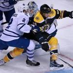 02/02/16: Boston, MA: The Bruins Louii Eriksson tries to work his way between Toronto defenseman Matt Hunwick (2) and goalieJames Reimer, as he rushes to the net in the first period. The Boston Bruins hosted the Toronto Maple Leafs in a regular season NHL hockey game at the TD Garden. (Globe Staff Photo/Jim Davis) section:sports topic:Bruins-Leafs