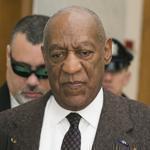 Actor and comedian Bill Cosby (third from left) was assisted as he arrived for a court appearance Wednesday in Norristown, Pa. 