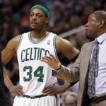 Boston Celtics forward Paul Pierce, left, confers with coach Doc Rivers, right, against the Phoenix Suns in an NBA basketball game Friday, Feb. 22, 2013, in Phoenix. (AP Photo/Paul Connors)