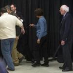 A person was helped out of the room after passing out during a Bernie Sanders news conference. 