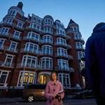 A television reporter stood outside the Ecuadoran Embassy, where WikiLeaks founder Julian Assange is holed up, in London on Thursday.