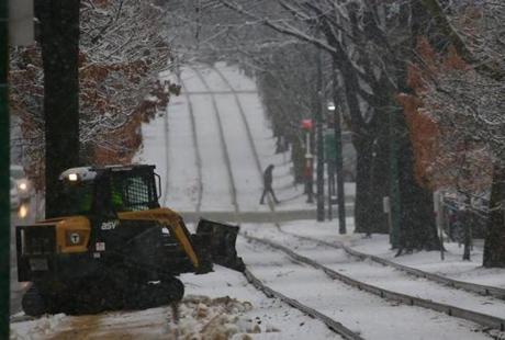 A small MBTA plow was used to clean off a Green Line waiting area.
