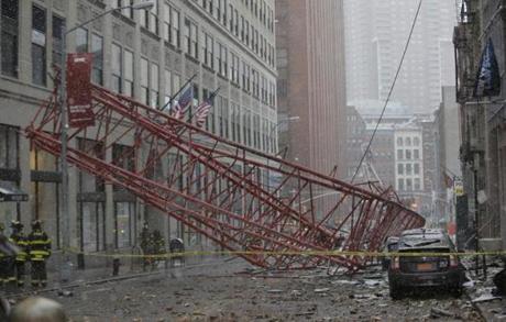 Emergency crews surveyed the collapsed crane in Lower Manhattan Friday.
