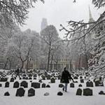 BOSTON, MA - 2/05/2016: WINTER WONDERLAND present at the the Old Granary Burial Ground was enjoyed for the first time seeing snow by Aylena Cerezo from Cuba now Miami arrived today just in time to see the snow with her friend Tim Hansell. SNOWFALL coming down throughout the city area of Boston (David L Ryan/Globe Staff Photo) SECTION: METRO TOPIC 06snow