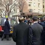 Mourners followed a hearse in front of a New York synagogue on Sunday. Funeral services were held for David Wichs, 38, a Harvard University graduate who was killed Friday by a collapsing crane in Manhattan.