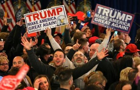Supporters at Trump headquarters at the Executive Court Banquet Facility cheered as CNN predicted Donald Trump a winner.
