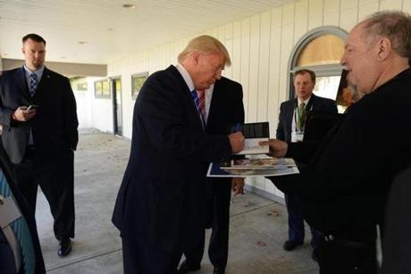 MANCHESTER, NH - APRIL 12: Donald Trump signs autographs after speaking at the Freedom Summit at The Executive Court Banquet Facility April 12, 2014 in Manchester, New Hampshire. The Freedom Summit held its inaugural event where national conservative leaders bring together grassroots activists on the eve of tax day. (Darren McCollester/Getty Images)

