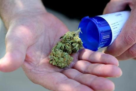Chuck Grant displayed his medical marijuana that he picked up from Massachusetts first medical marijuana dispensary in Salem last June.
