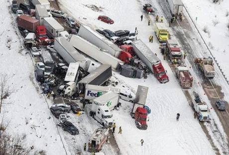 Vehicles pile up at the site of a fatal crash near Fredericksburg, Pa., Saturday, Feb. 13, 2016. The pileup left tractor-trailers, box trucks and cars tangled together across several lanes of traffic and into the snow-covered median. (James Robinson/PennLive.com via AP) MANDATORY CREDIT; MAGS OUT
