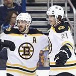 Boston Bruins' Loui Eriksson, right, of Sweden, celebrates his game-winning goal against the Columbus Blue Jackets with teammates Torey Krug, left, and David Krejci, of the Czech Republic, during the overtime period of an NHL hockey game Tuesday, Feb. 16, 2016, in Columbus, Ohio. The Bruins beat the Blue Jackets 2-1 in overtime. (AP Photo/Jay LaPrete)