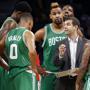 Boston Celtics head coach Brad Stevens gives instructions during a timeout against the Detroit Pistons in the second half of an NBA basketball game Wednesday, Dec. 16, 2015 in Auburn Hills, Mich. (AP Photo/Paul Sancya)