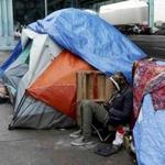 A homeless man took shelter under a freeway during an El Nino driven storm in San Francisco in January.