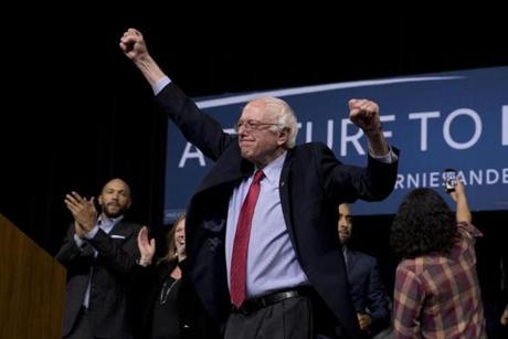 Democratic presidential candidate Sen. Bernie Sanders, I-Vt., center, holds his arms up as he acknowledges the cheering crowd after a rally Friday, Feb. 19, 2016, in Henderson, Nev. (AP Photo/Jae C. Hong)

