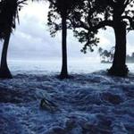 In this Jan. 21, 2015 photo released by Bikini Atoll Local Government, waves surge during a king tide event on Kili in the Marshall Islands. Two king tide events has hit the Kili in 2015 causing massive flooding over the entire island which left thousands of dead fish to rot after the waters resided. Climate change poses an existential threat to places like the Marshall Islands, which protrude only 6 feet (2 meters) above sea level in most places. (Bikini Atoll Local Government via AP)
