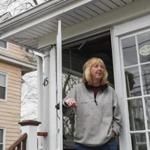 Watertown, MA - 2/23/2016 - Jean McDonald looks out from her home on Laurel Street where a shoot out with police and the Boston Marathon bombers Dzhokhar and Tamerlan Tsarnaev occurred in Watertown, MA, February 23, 2016. Film makers are seeking approval from residents in the neighborhood to re-create the event for the film 