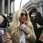 Pop star Kesha left court Friday after losing a bid to be end her contract with producer Dr. Luke.