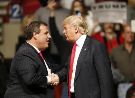 New Jersey Gov. Chris Christie, left, greets Republican presidential candidate Donald Trump, right, at a rally in Oklahoma City, Friday, Feb. 26, 2016. (AP Photo/Sue Ogrocki)

