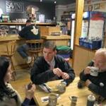 After the mayoral primary in 2013, Martin J. Walsh sat with his advisor Michael Goldman (right) and press secretary Kate Norton  in Dorchester restaurant.