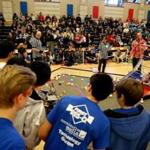 Team Infinity Factor watches their robot during competition at the Massachusetts First Tech Challenge State Championships at Natick High School.