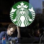 A man sat inside a Starbucks restaurant in New York last month. 