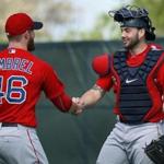 Red Sox catcher Blake Swihart, shaking hands with new closer Craig Kimbrel after a bullpen session, believes that a catcher is an extension of the coaching staff.
