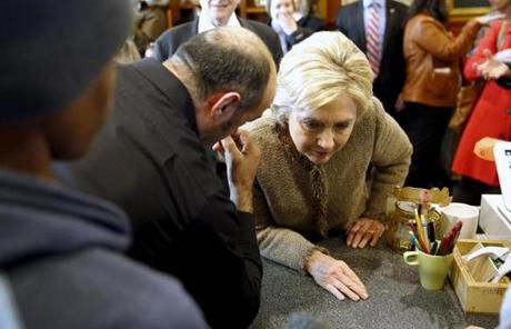 Hillary Clinton listened to a man while meeting people at Mapps Coffee in Minnesota.
