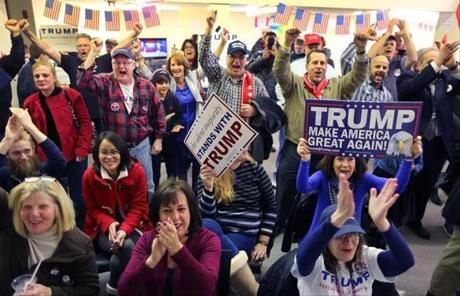 Donald Trump supporters celebrated at his Massachusetts headquarters in Littleton after he was declared a winner in the state primary.
