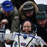 Ground personnel helped Scott Kelly to get off the Soyuz TMA-18M space capsule after landing near the town of Dzhezkazgan, Kazakhstan.