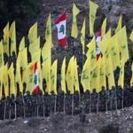 Hezbollah fighters held their group?s flag as well as Lebanon?s national flag during a rally. 