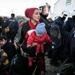 A woman looked for her husband and son as she was allowed to cross into Macedonia at the Greek-Macedonian border, near the Greek village of Idomeni, on Wednesday.