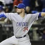 Chicago Cubs pitcher Jon Lester throws during the first inning of Game 1 of the National League baseball championship series against the New York Mets Saturday, Oct. 17, 2015, in New York. (AP Photo/David J. Phillip) 