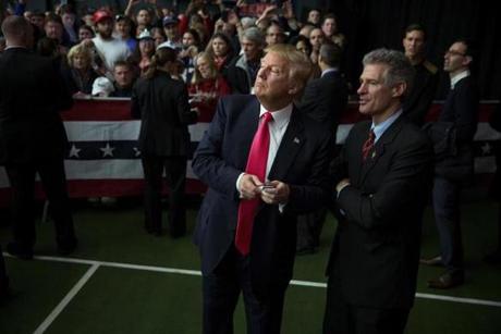 FILE-- Donald Trump, a Republican presidential hopeful, consults with former Sen. Scott Brown as he greets the crowd after speaking at a campaign event at the Hampshire Hills Athletic Club in Milford, N.H., Feb. 2, 2016. In a 2014 race, Scott Brown struck a chord with the state's voters uneasy with border issues. Brown lost, but he may have set the tone for Trump. (Damon Winter/The New York Times)
