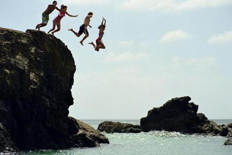 Jumping off rocks in New Zealand.
