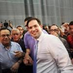 Marco Rubio (center) shook hands with supporters while campaigning in Toa Baja, Puerto Rico, on Saturday.
