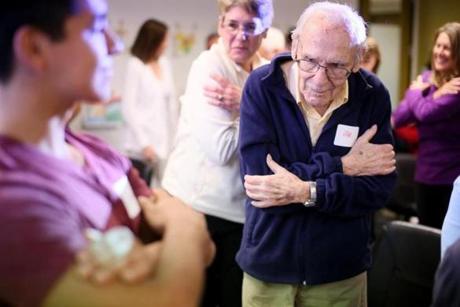 Alzheimer?s patient Abe Horstain stretches during the movement class.
